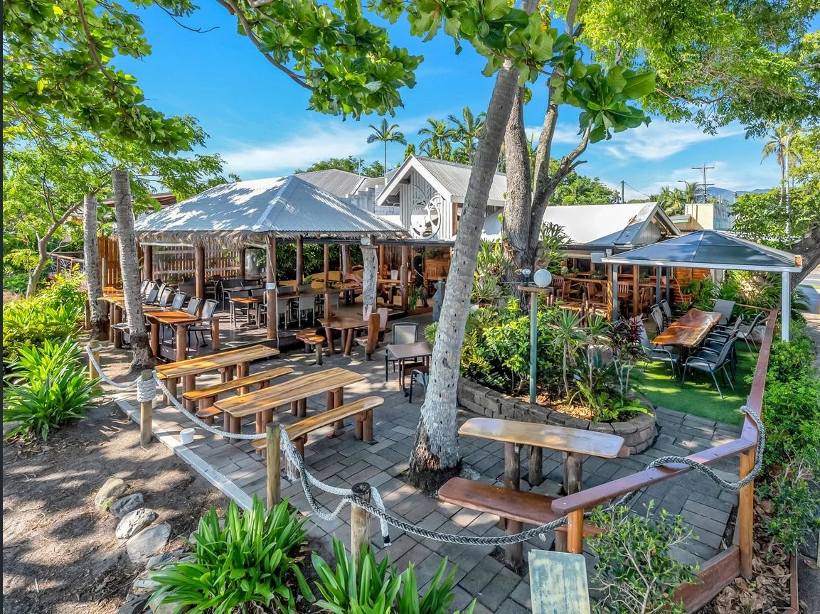 The open-air café and shaded terrace beside Holloways Beach